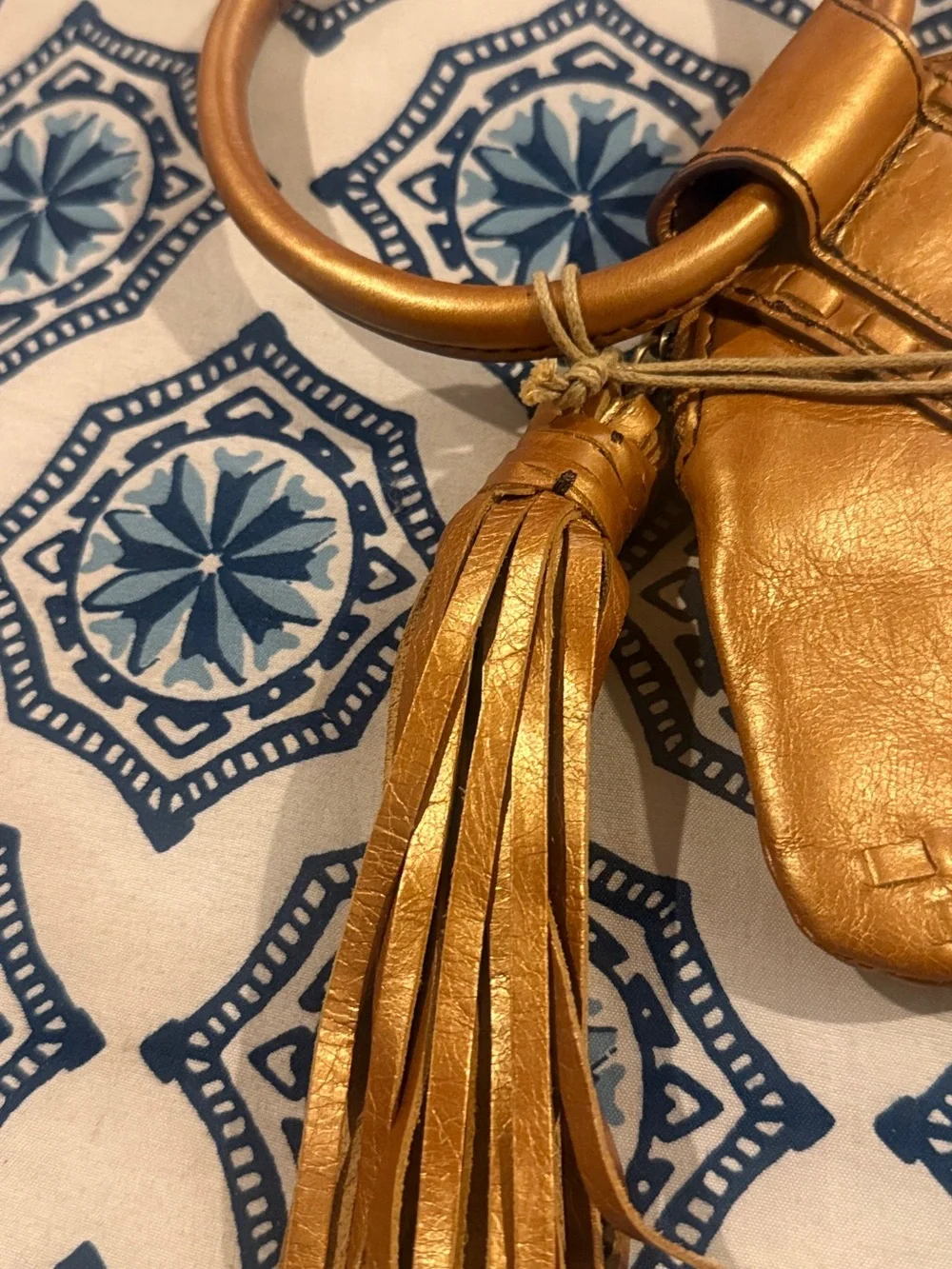 HOBO Metallic Gold Leather Wristlet with Tassel and Ring Handle